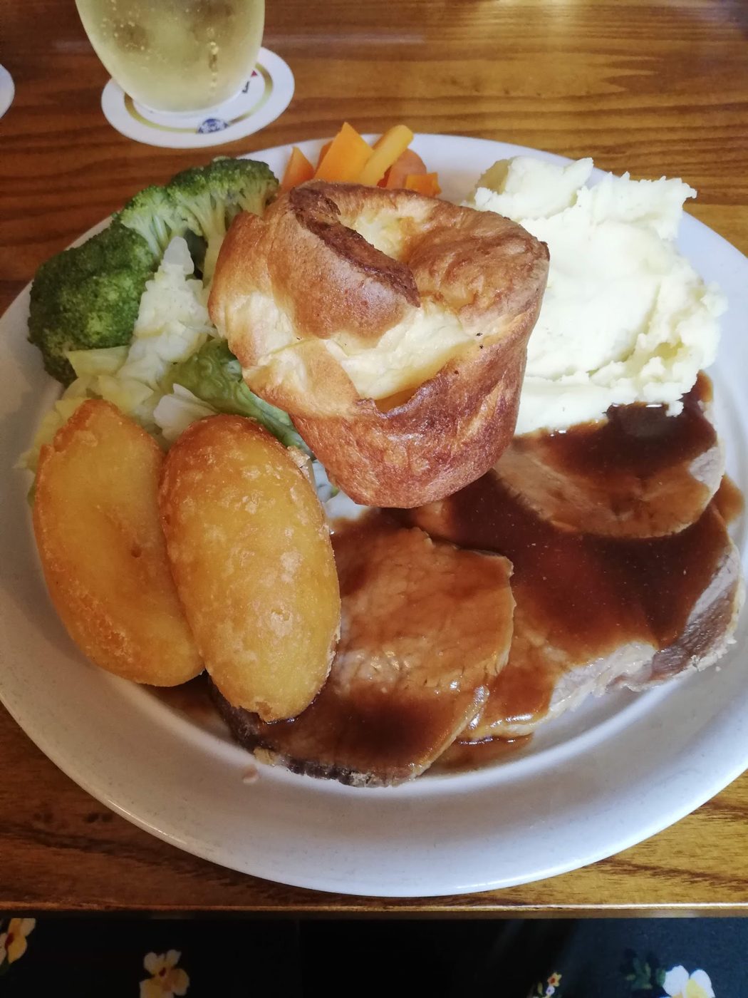 A roast dinner with potatoes and vegetables