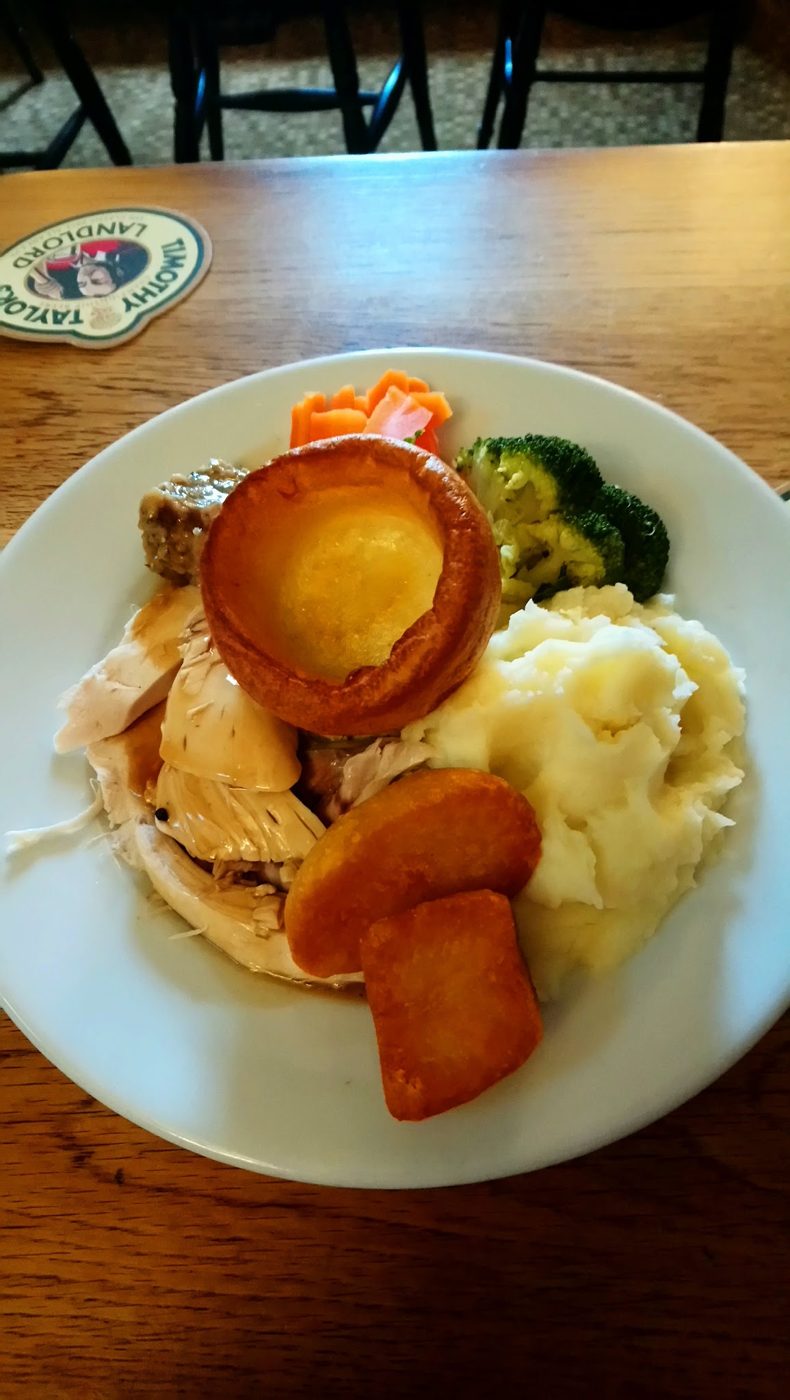 A roast with a Yorkshire pudding and carrots